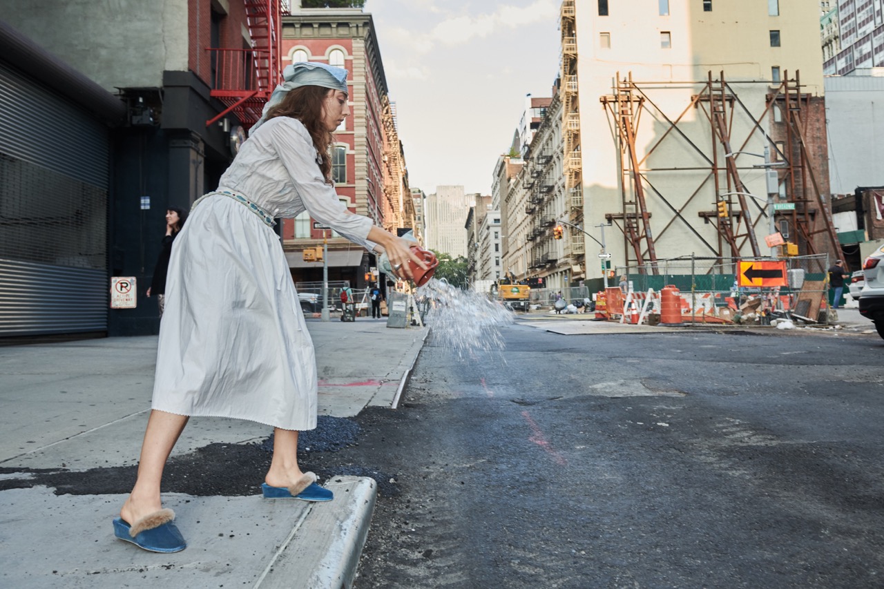 Photo of performance throwng water on the streets of Manhattan