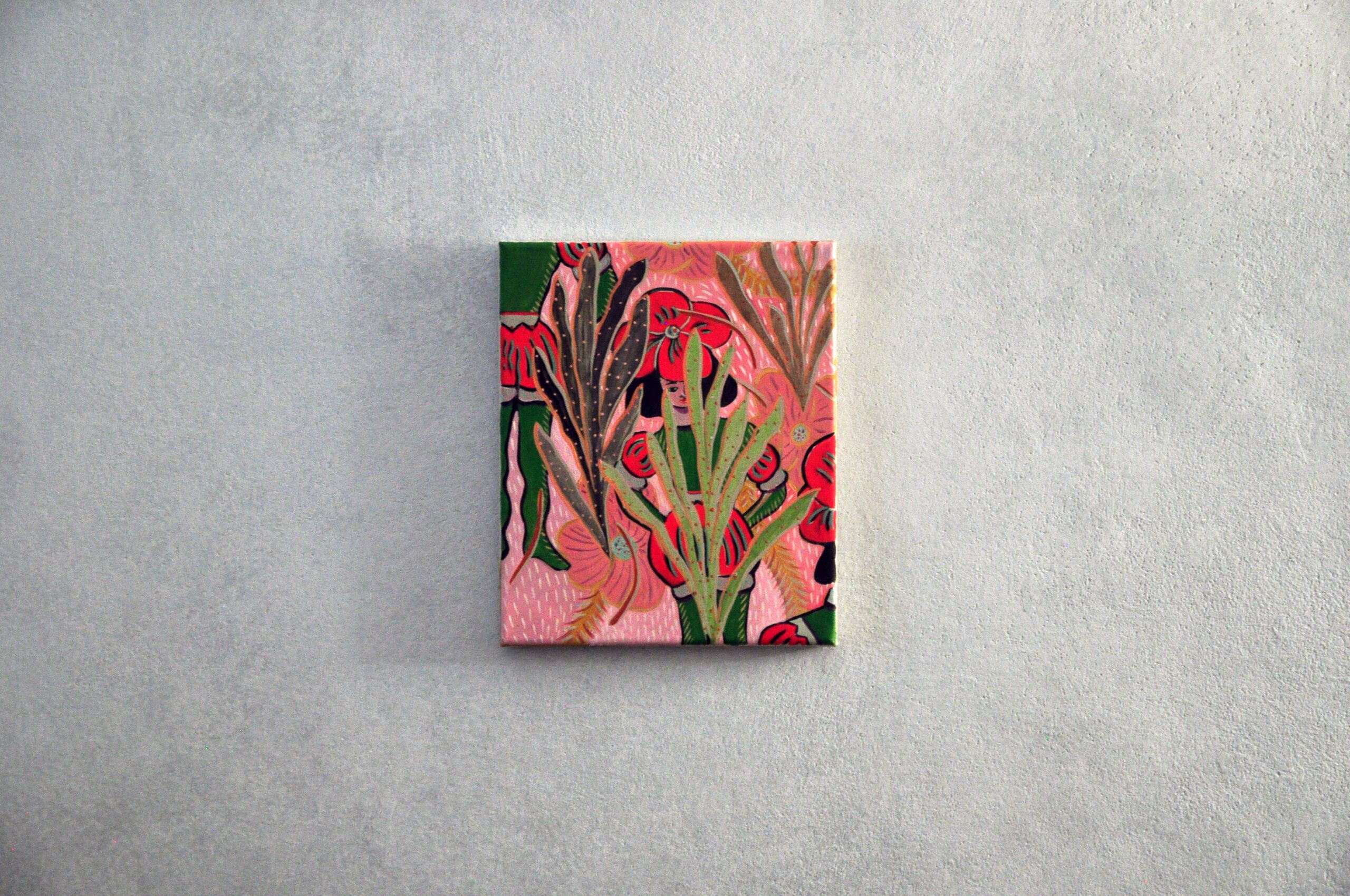 Small pink and green painting of a flower boy