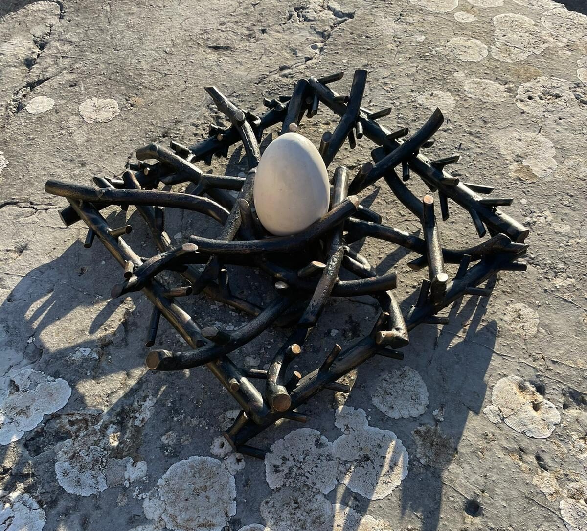 Bronze sculpture of nest with gesmonite egg